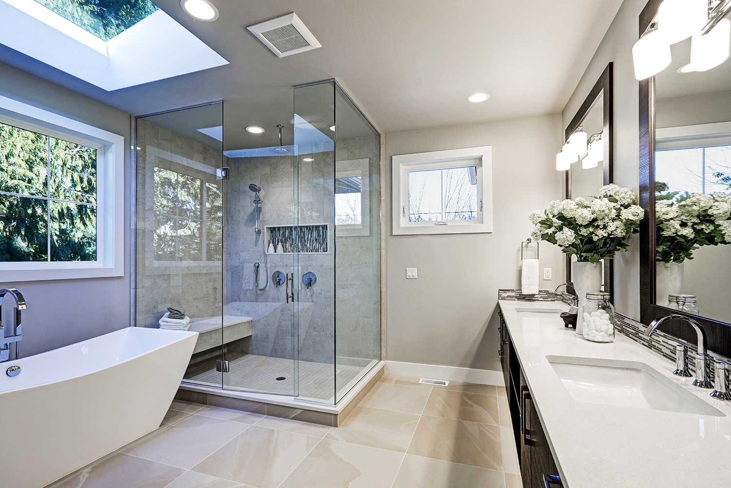 Frameless heavy-glass shower enclosure installed by Dubuque Glass